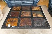 Top view of the rectangular slate coffee table showing the patterned slate tiles in a 3x3 grid with earthy natural colors