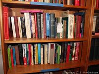 Bookshelves filled with various science and technology themed books including chemistry, physics, biology, art, and computing.