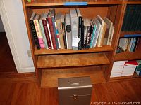 Books on shelves, mostly art-themed, some teaching materials visible.